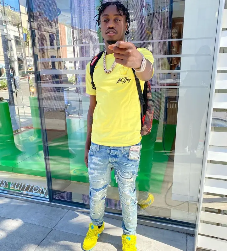 Lil Tjay outfit in Amiri, Nike, and Sprayground, 2021