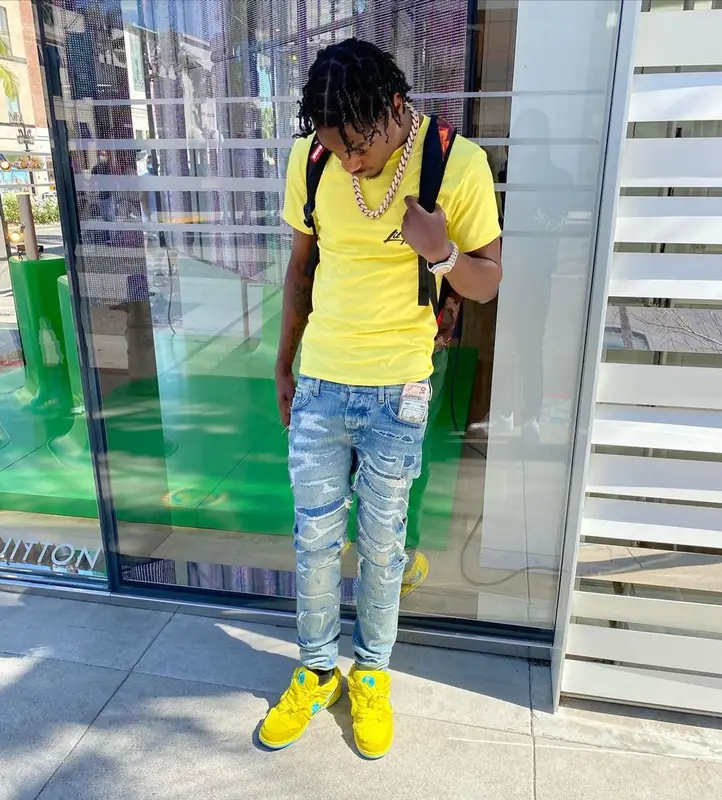 Lil Tjay outfit in Amiri, Nike, and Sprayground, 2021