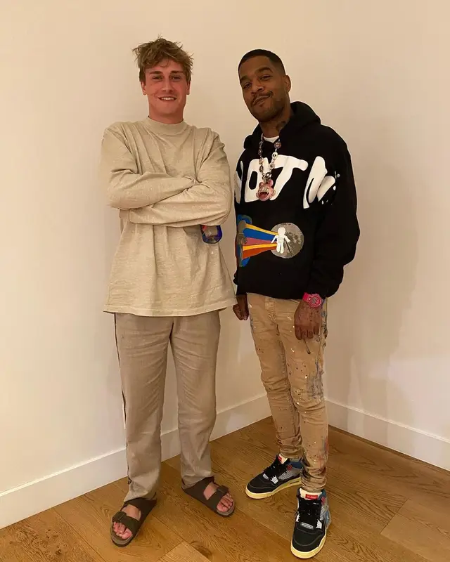 Kid Cudi outfit in Cactus Plant Flea Market, Purple Brand, and Bape, 2021