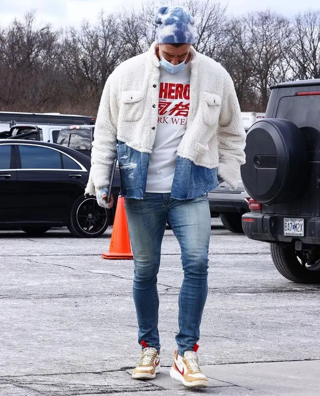 Travis Kelce outfit in Greg Lauren, Heron Preston, and The Elder Statesman, 2021