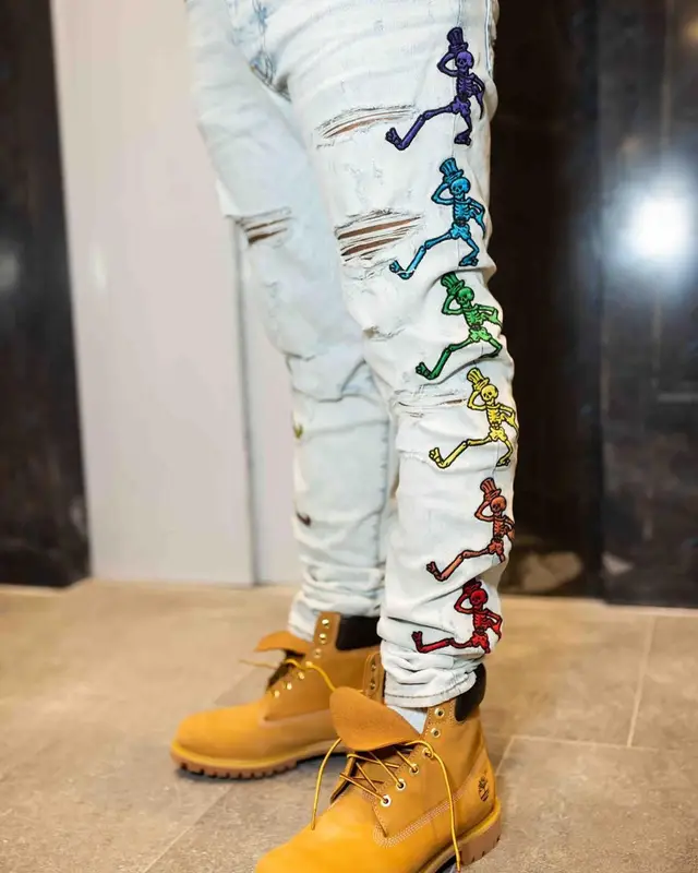 Rowdy Rebel outfit in Gucci, Chanel, and Pharrell Williams Merch, 2021