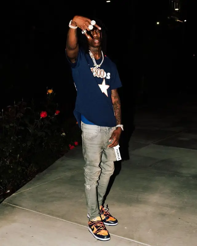 Polo G outfit in Mitchell & Ness, Purple Brand, and Nike, 2021