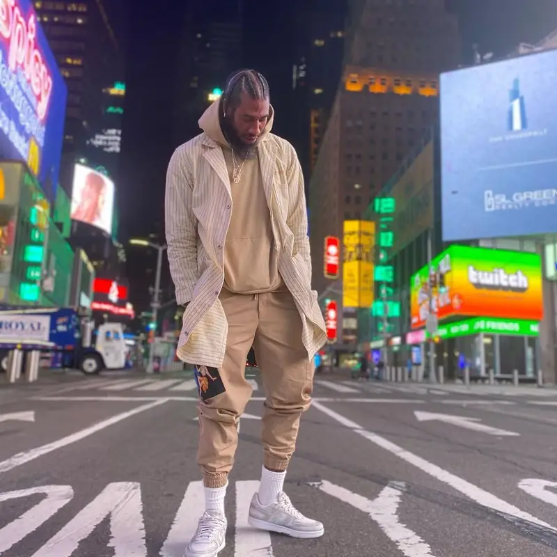Iman Shumpert outfit in Human Made, Dolce & Gabbana, and John Geiger, 2021