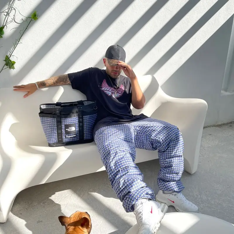 Feid outfit in Feid Merch, Supreme, and Louis Vuitton, 2021