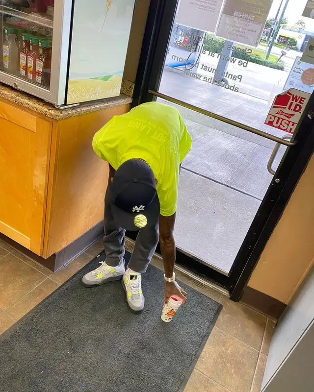 Quando Rondo outfit in Helmut Lang, Jordan, and New Era, 2021