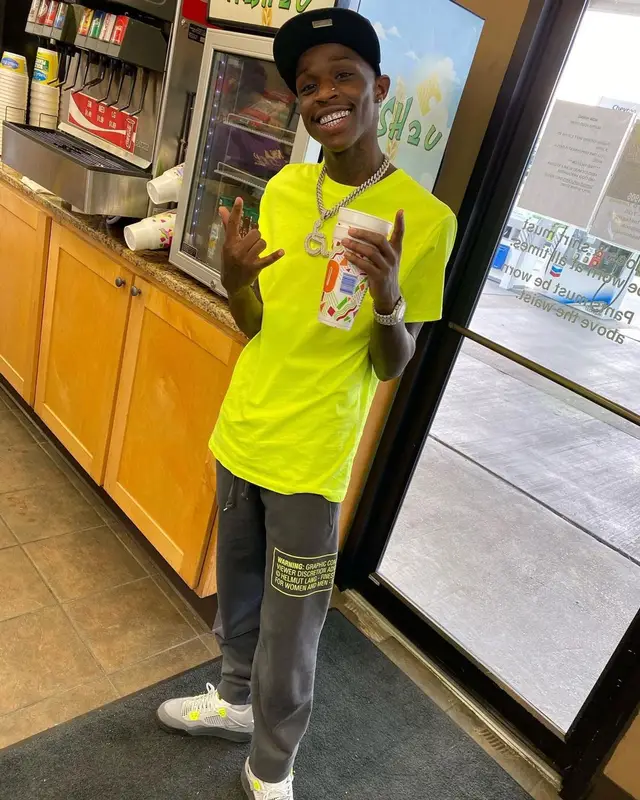 Quando Rondo outfit in Helmut Lang, Jordan, and New Era, 2021