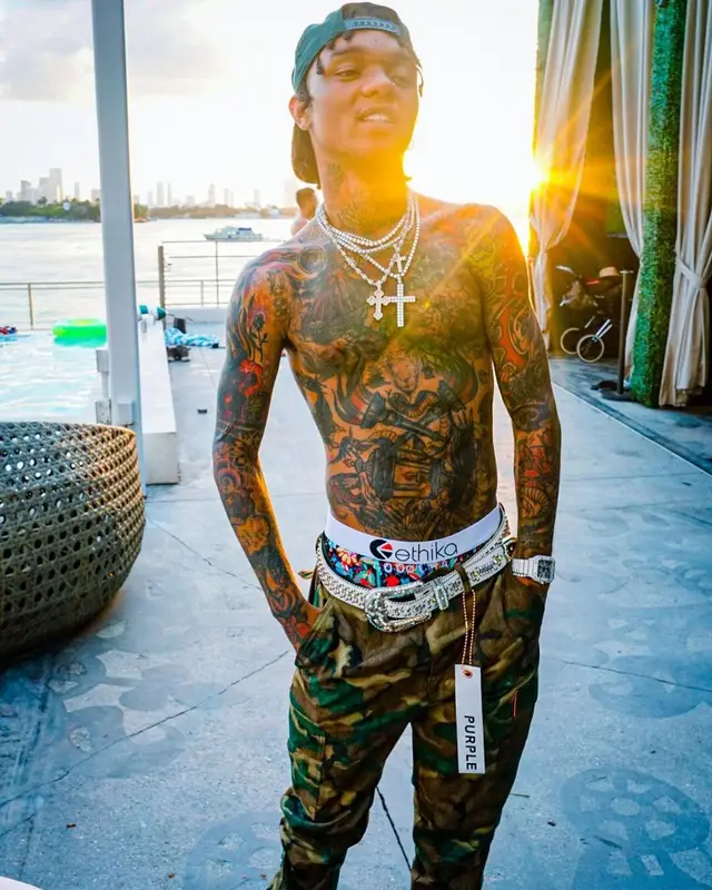 Swae Lee outfit in Purple Brand, B.B. Simon, and Ethika, 2021