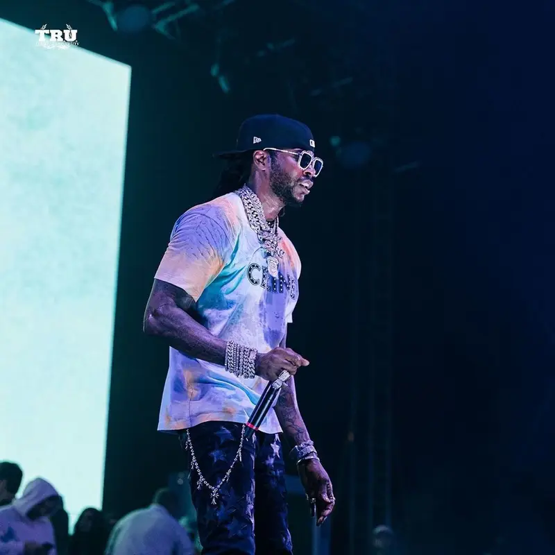 2 Chainz outfit in Celine, Louis Vuitton, and New Era, 2021