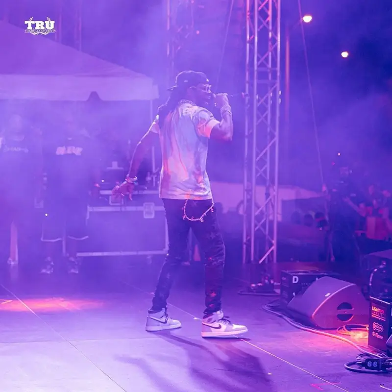 2 Chainz outfit in Celine, Louis Vuitton, and New Era, 2021