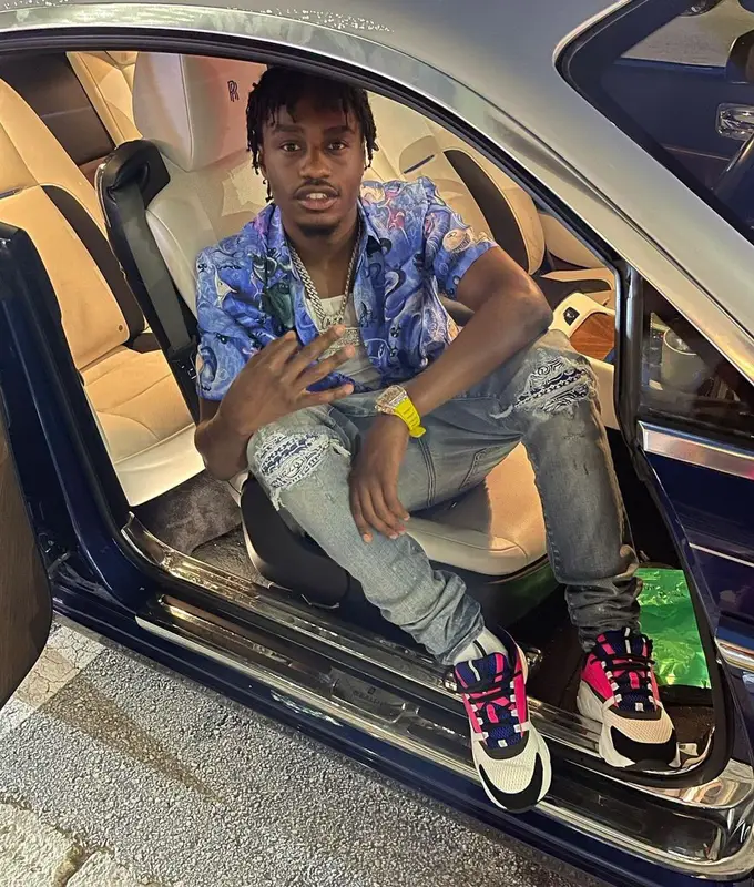 Lil Tjay outfit in Dior, Amiri, and Kenny Scharf, 2021