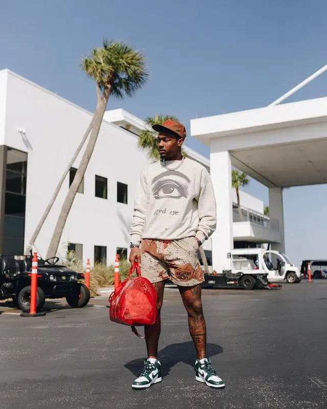 Stefon Diggs outfit in Readymade, Louis Vuitton, and Cactus Jack, 2021