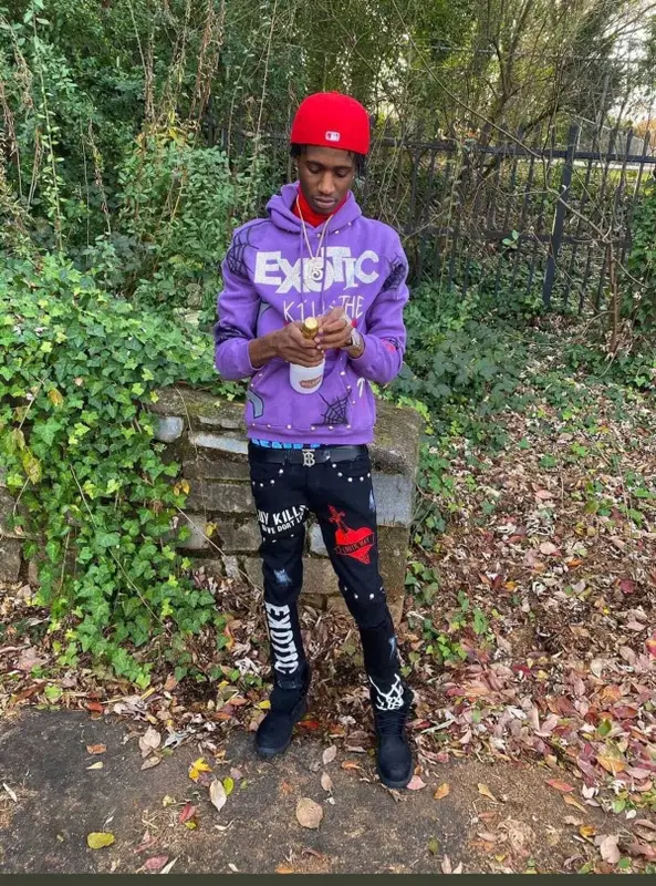 Yung Mal outfit in Timberland, Burberry, and New Era, 2021