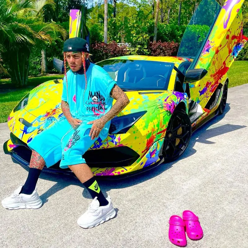 6ix9ine outfit in BooHooMan, Versace, and Crocs, 2021