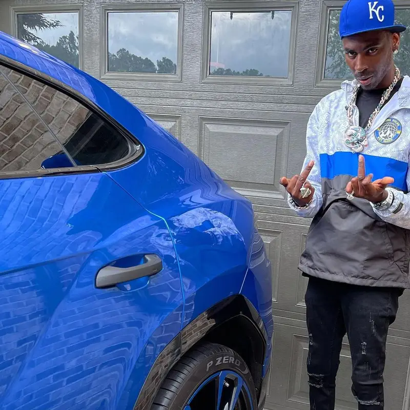 Young Dolph outfit in Young Dolph Merch, Jordan, and New Era, 2021