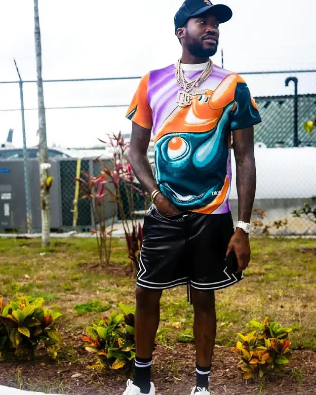 Meek Mill outfit in Dior, Amiri, and Louis Vuitton, 2021
