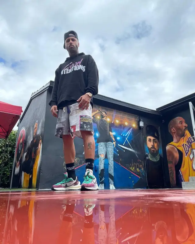 Nicky Jam outfit in Vlone, Nav Merch, and Gallery Dept., 2021