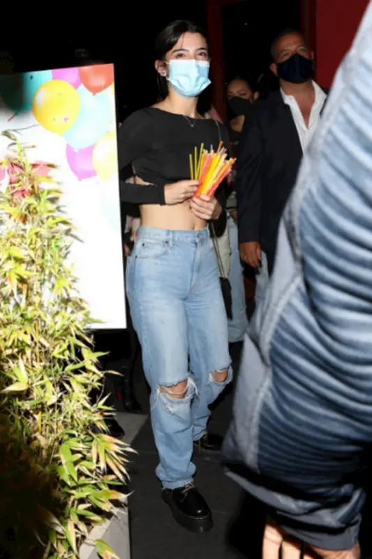 Charli D'Amelio outfit in Dr. Martens, Gucci, and Evolve Together, 2021