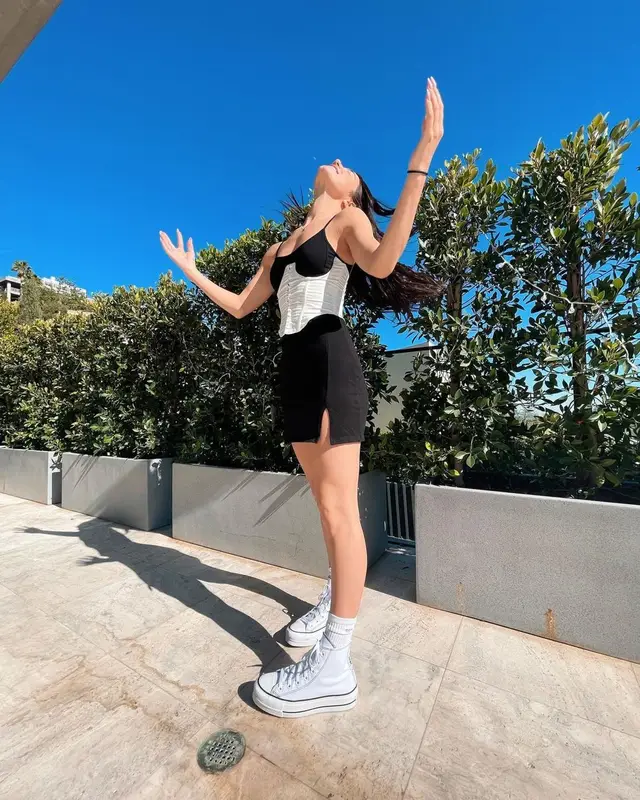 Charli D'Amelio outfit in Converse, Balenciaga, and Evolve Together, 2021