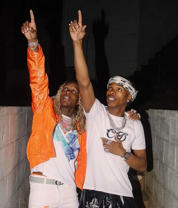 Lil Durk outfit in Dior, Louis Vuitton, and Kenny Scharf, 2021