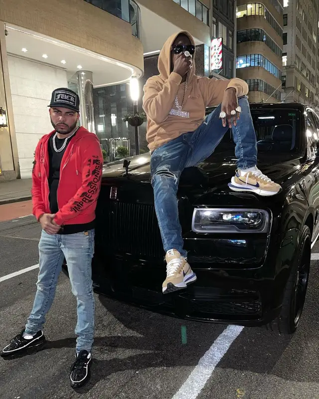Bobby Shmurda outfit in Amiri, Nike, and Versace, 2021