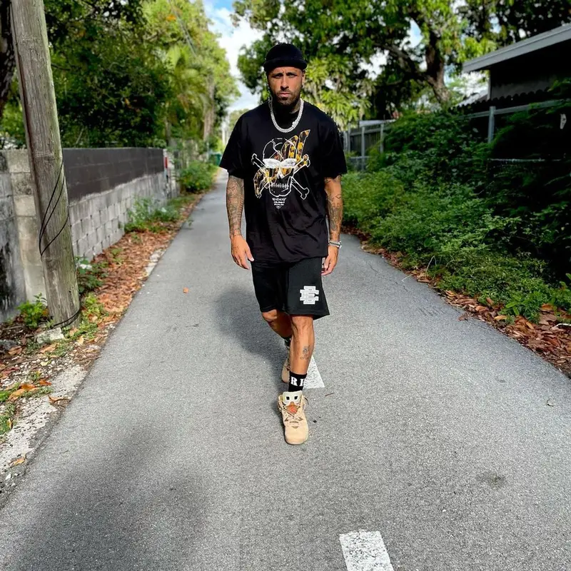 Nicky Jam outfit in Givenchy, Eric Emanuel, and Rhude, 2021