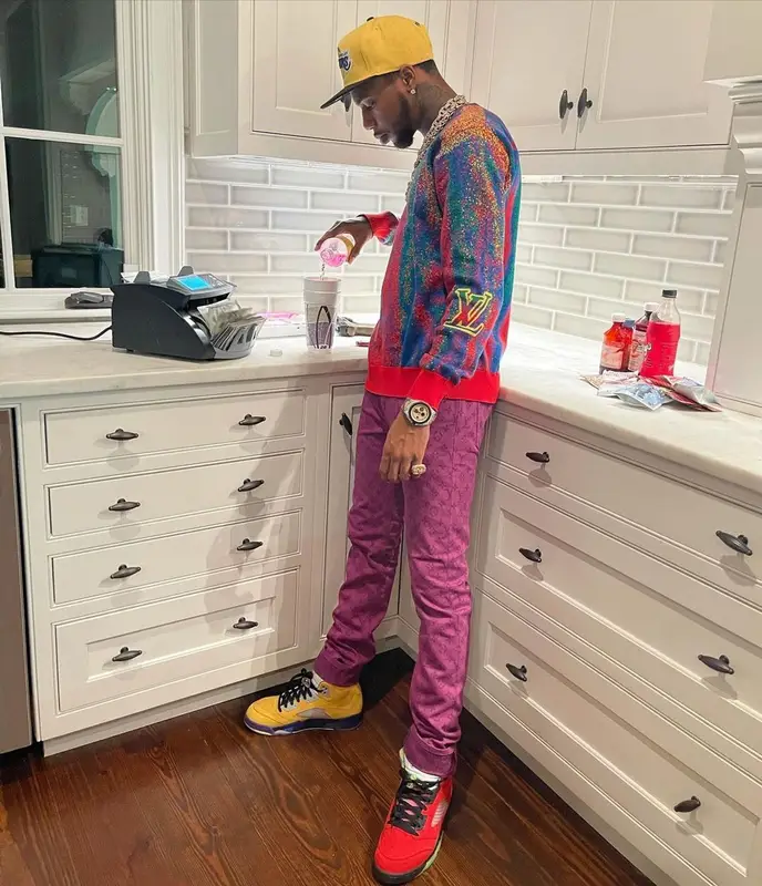 Key Glock outfit in Louis Vuitton, Jordan, and New Era, 2021