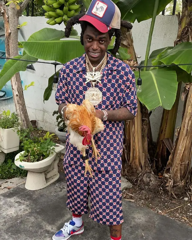 Kodak Black outfit in Gucci, Nike, and Goorin Bros, 2021