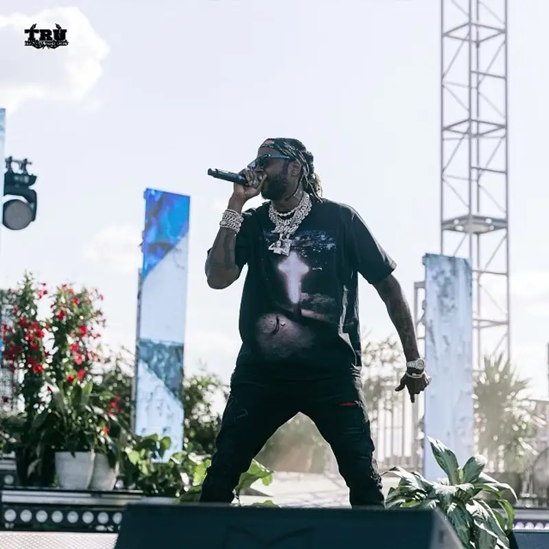2 Chainz outfit in Amiri, Supreme, and Louis Vuitton, 2021