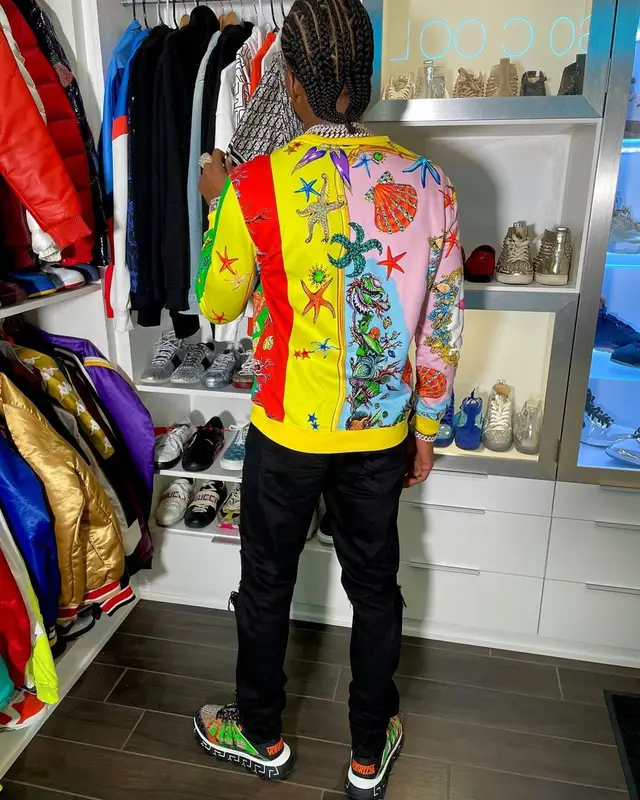 CJ So Cool outfit in Versace, Amiri, and Louis Vuitton, 2021