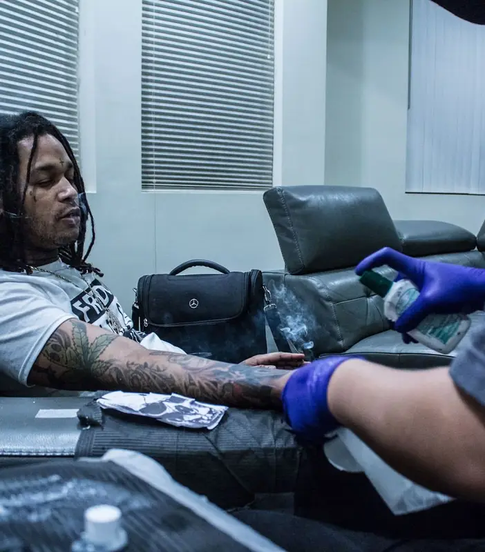 Fredo Santana outfit in Savage Squad Records Merch and Nike, 2018