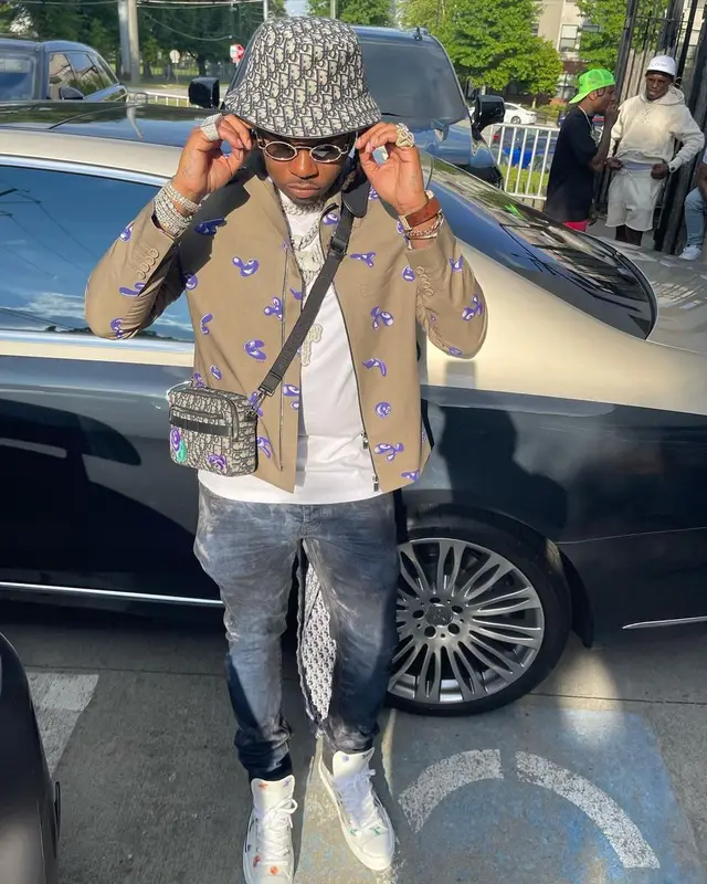 Gunna outfit in Kenny Scharf, Purple Brand, and Dior, 2021