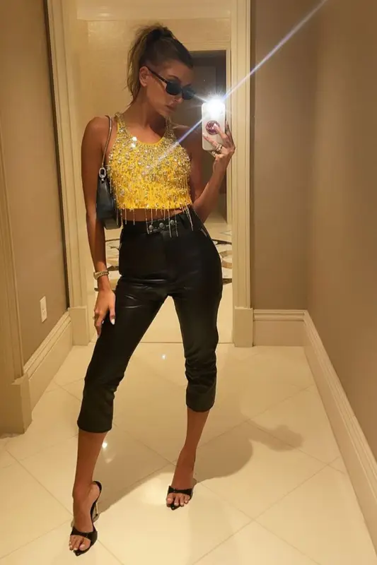 Hailey Bieber outfit in Miu Miu, The Attico, and Linda Farrow, 2021