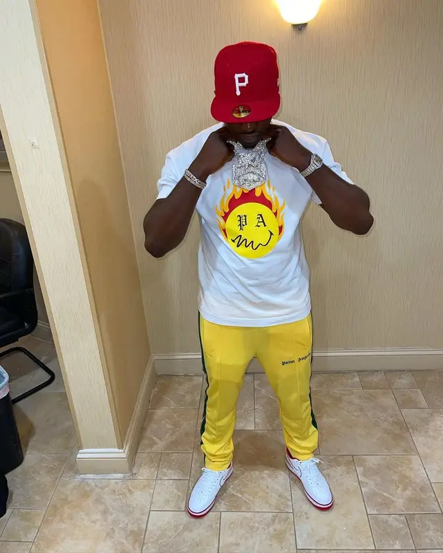Bankroll Freddie outfit in Palm Angels, Nike, and New Era, 2021
