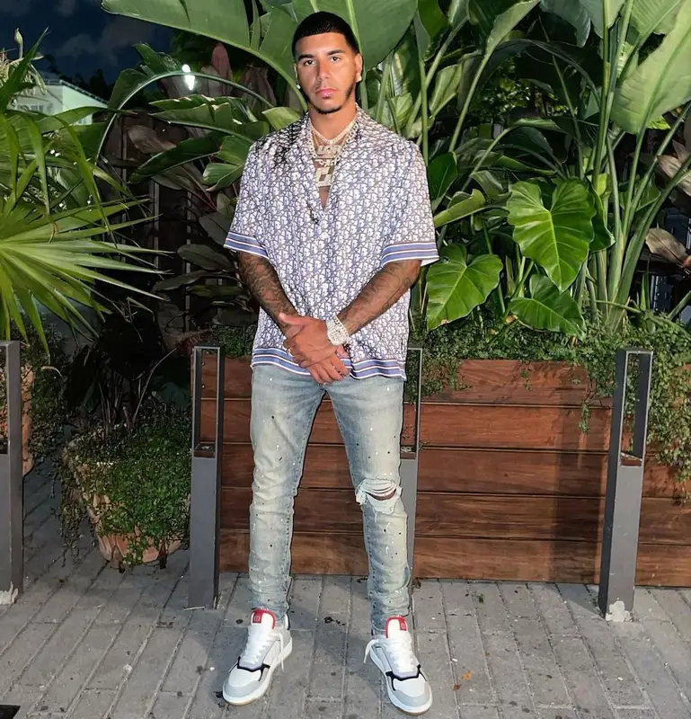 CJ outfit in Dior and Purple Brand, 2021