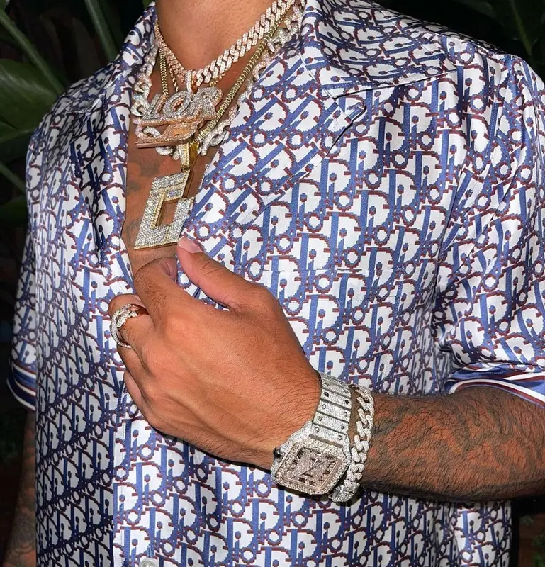 CJ outfit in Dior and Purple Brand, 2021