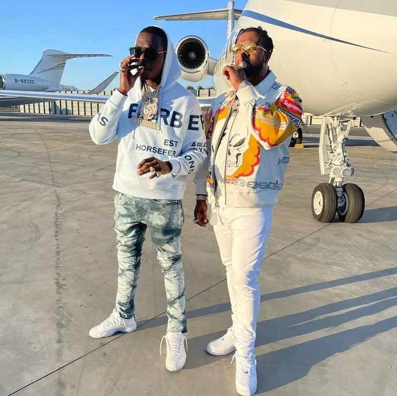 Bobby Shmurda outfit in Burberry, Purple Brand, and Prada, 2021