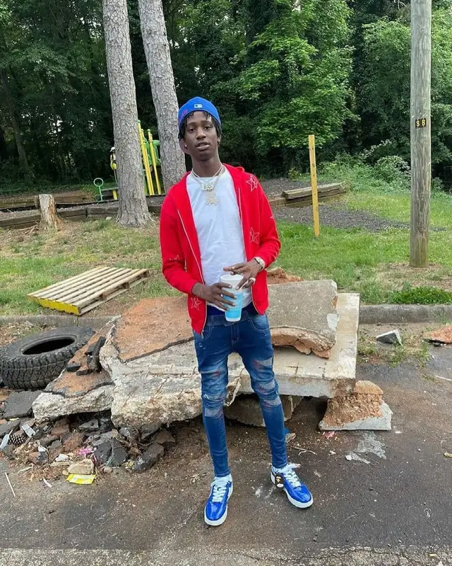 Yung Mal outfit in Reyell Uni, Bape, and Louis Vuitton, 2021