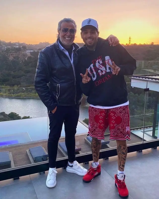 Chris Brown outfit in Rhude, Amiri, and New Era, 2021