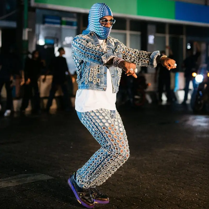 Burna Boy outfit in Maison Margiela, Louis Vuitton, and Marine Serre, 2021