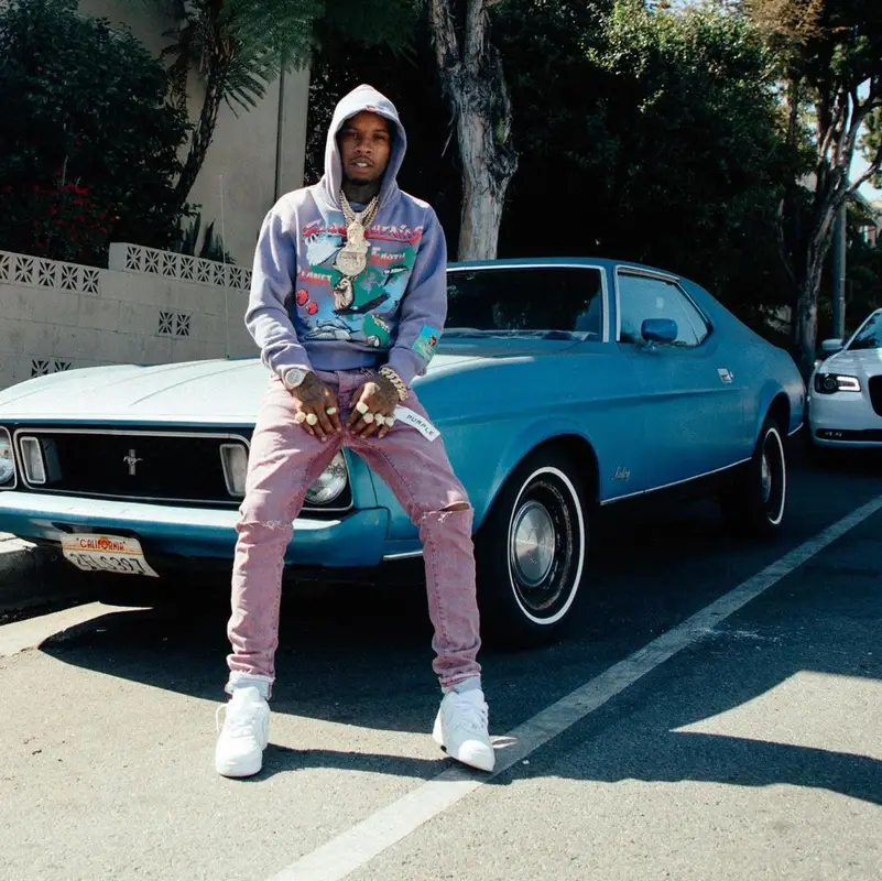 Tory Lanez outfit in Jungles, Purple Brand, and Nike, 2021