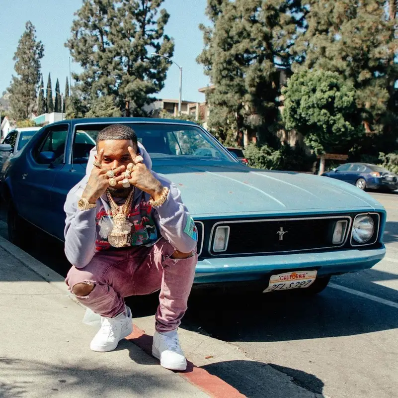 Tory Lanez outfit in Jungles, Purple Brand, and Nike, 2021