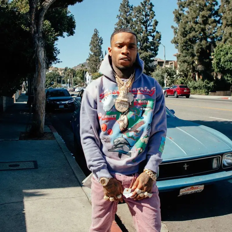 Tory Lanez outfit in Jungles, Purple Brand, and Nike, 2021