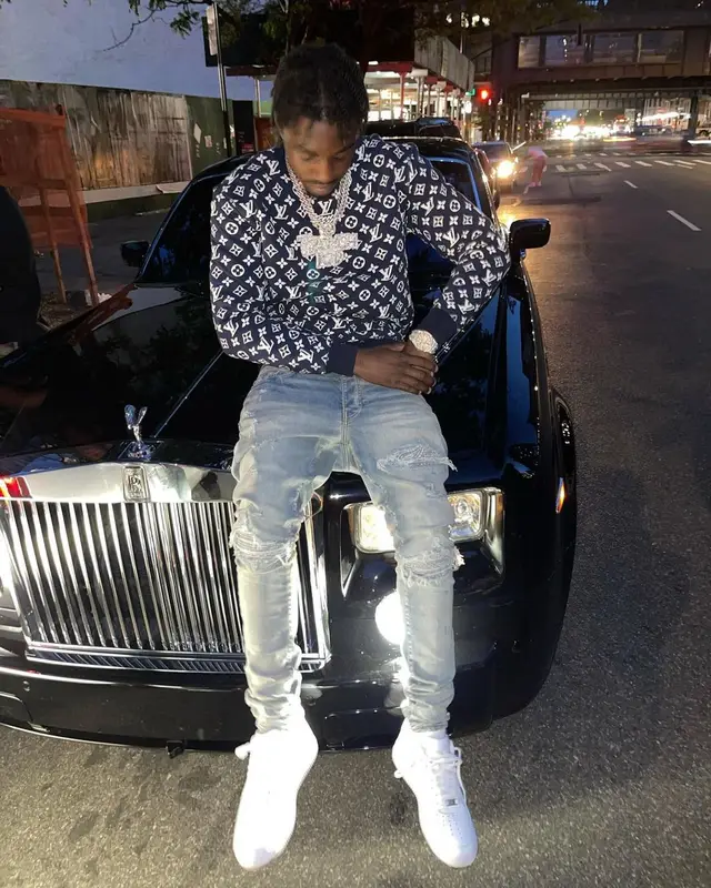 Lil Tjay outfit in Louis Vuitton, Amiri, and Nike, 2021