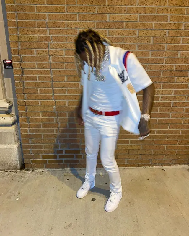 Lil Durk outfit in Louis Vuitton, Valentino, and NBA, 2021