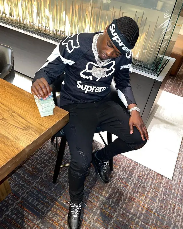 Bankroll Freddie outfit in Nike, Supreme, and New Era, 2021