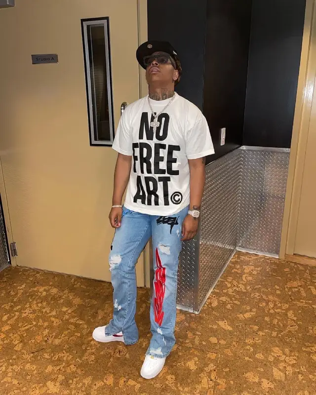 Lil Gotit outfit in Cosey X Cosey, New Era, and Dolce & Gabbana, 2021