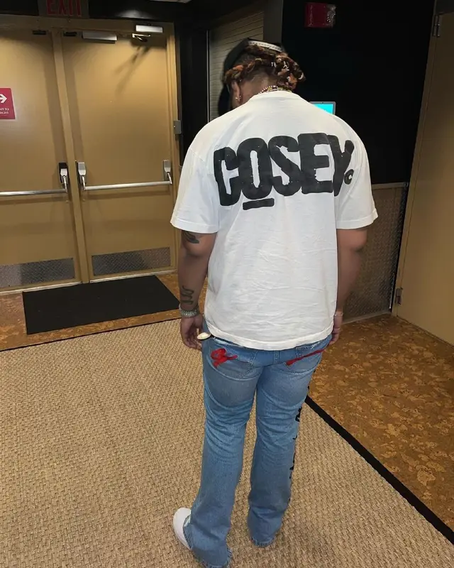 Lil Gotit outfit in Cosey X Cosey, New Era, and Dolce & Gabbana, 2021