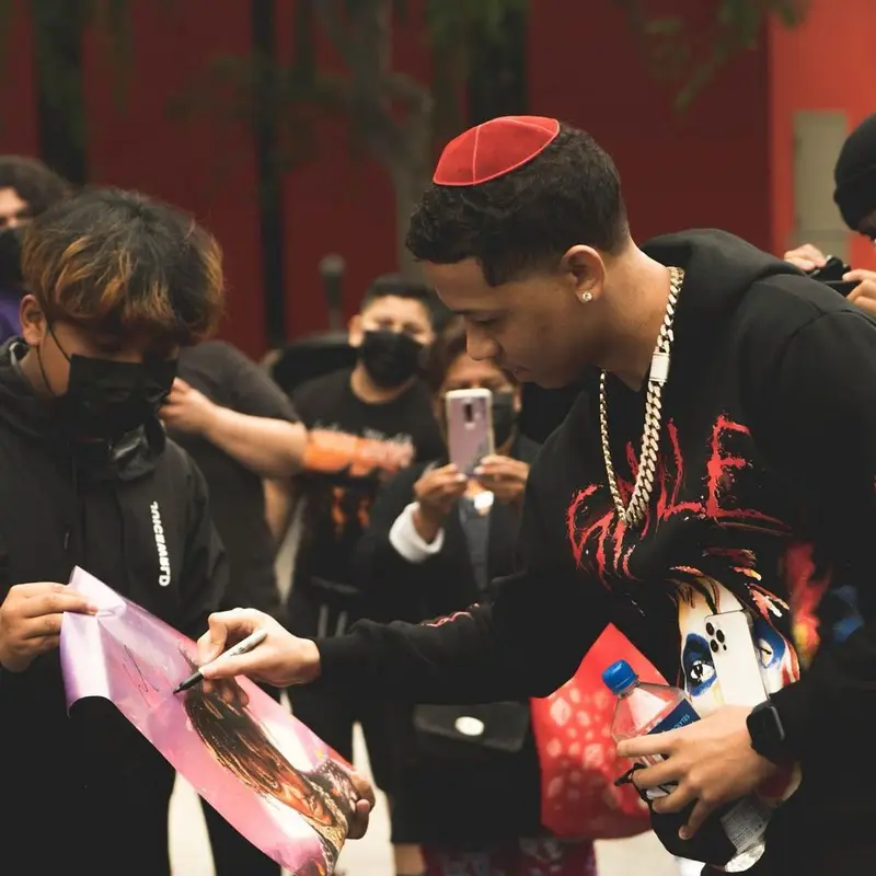 Lil Bibby outfit in Vlone, Mitchell & Ness, and Juice Wrld Merch, 2021