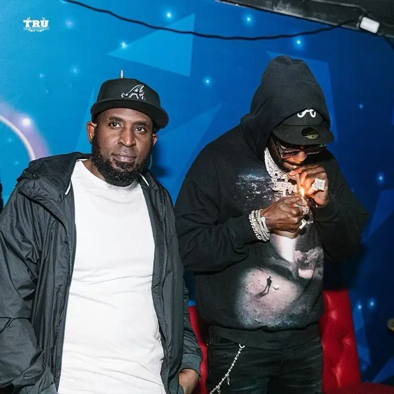 2 Chainz outfit in Amiri, Louis Vuitton, and New Era, 2021