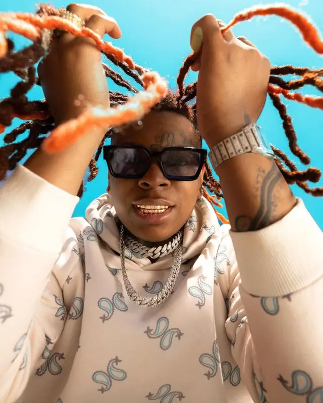 Lil Gotit outfit in BooHooMan, Nike, and Louis Vuitton, 2021